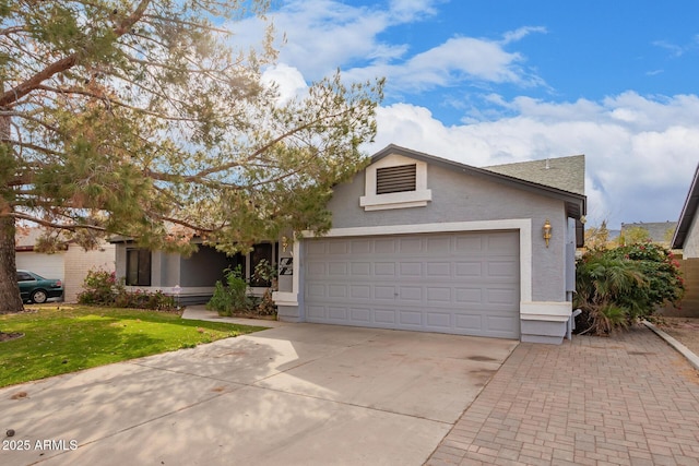 view of front of house with a garage and a front lawn