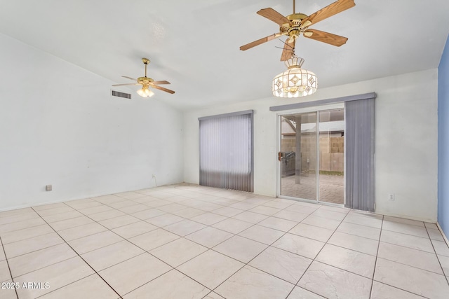 tiled spare room with lofted ceiling and ceiling fan