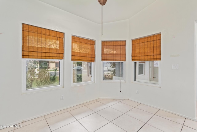 spare room with light tile patterned floors