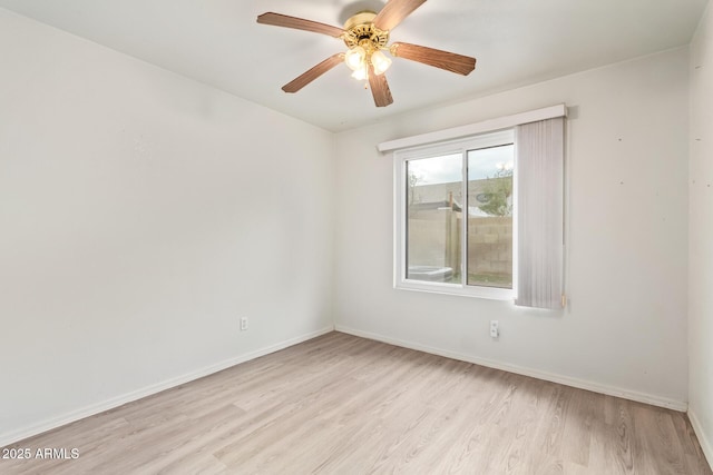 unfurnished room featuring ceiling fan and light wood-type flooring