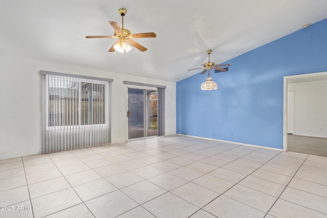 empty room featuring lofted ceiling, light tile patterned floors, and ceiling fan