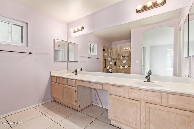 bathroom with vanity, tile patterned floors, a healthy amount of sunlight, and walk in shower