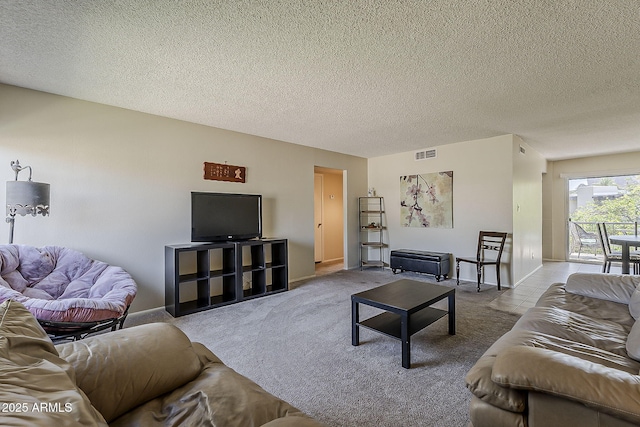 4201 E Camelback Rd Unit 74, Phoenix, AZ 85018 - carpeted living area with a textured ceiling