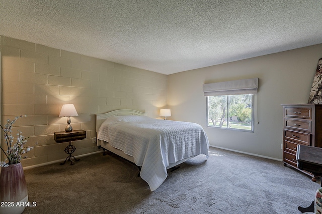 4201 E Camelback Rd Unit 74, Phoenix, AZ 85018 - carpeted bedroom featuring concrete block wall and a textured ceiling