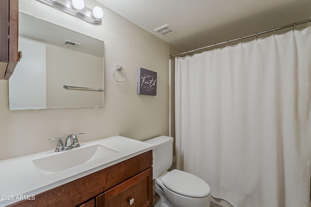 4201 E Camelback Rd Unit 74, Phoenix, AZ 85018 - bathroom featuring toilet and vanity