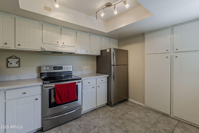 4201 E Camelback Rd Unit 74, Phoenix, AZ 85018 - kitchen with appliances with stainless steel finishes, under cabinet range hood, light countertops, light tile patterned floors, and white cabinetry