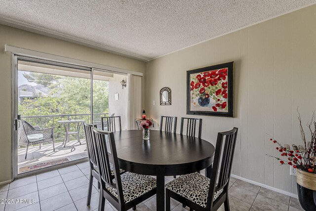 4201 E Camelback Rd Unit 74, Phoenix, AZ 85018 - dining room with light tile patterned floors and a textured ceiling