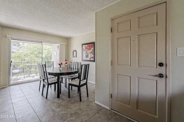 4201 E Camelback Rd Unit 74, Phoenix, AZ 85018 - dining area with a textured ceiling and light tile patterned floors