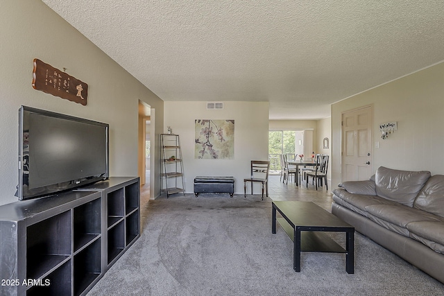 4201 E Camelback Rd Unit 74, Phoenix, AZ 85018 - living area with carpet floors and a textured ceiling