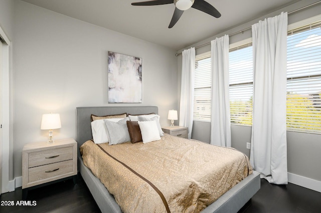 19777 N 76th St Unit 3229, Scottsdale, AZ 85255 - bedroom featuring baseboards, dark wood-style floors, and ceiling fan