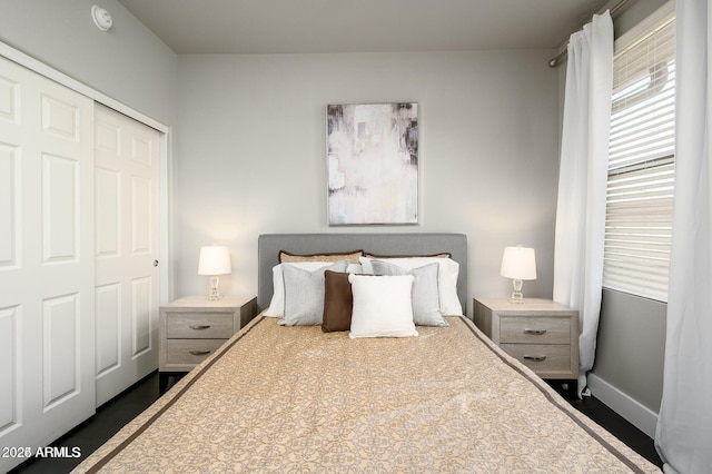 19777 N 76th St Unit 3229, Scottsdale, AZ 85255 - bedroom with a closet, baseboards, and dark wood-style flooring