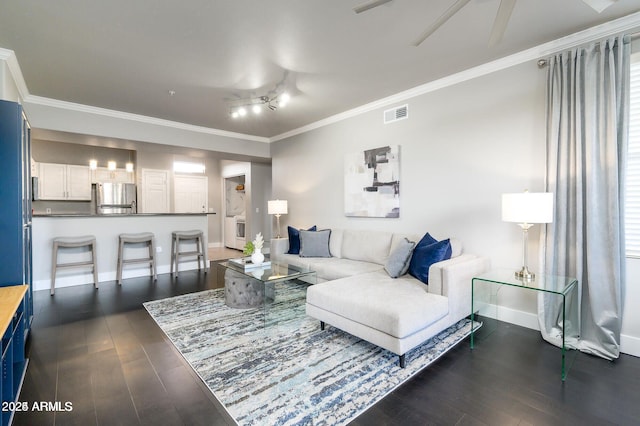 19777 N 76th St Unit 3229, Scottsdale, AZ 85255 - living area featuring a ceiling fan, dark wood finished floors, crown molding, and baseboards