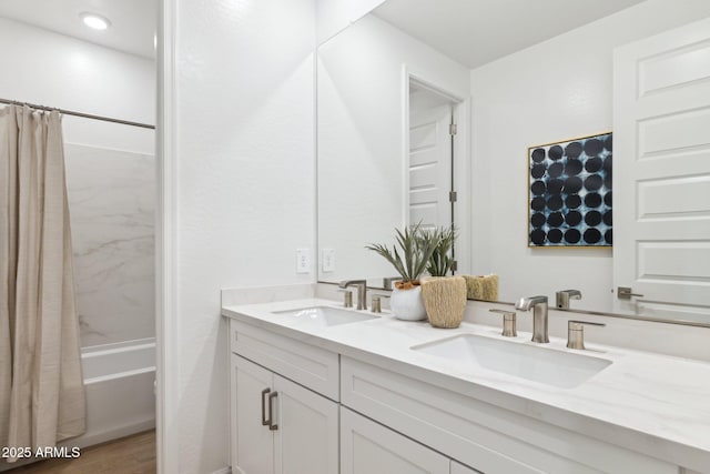 9815 S 11th St, Phoenix, AZ 85042 - full bath featuring double vanity, shower / bath combo with shower curtain, and wood finished floors