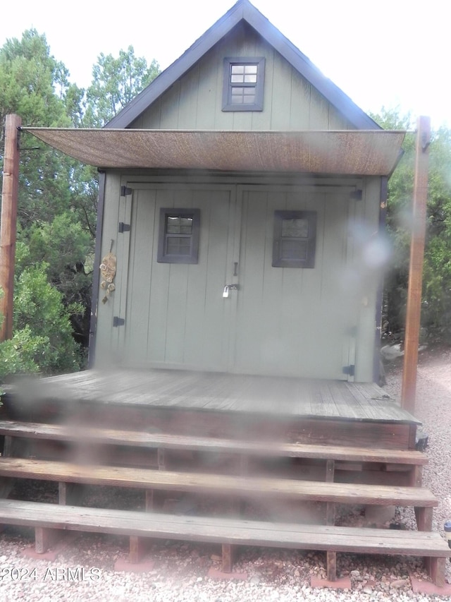 view of outbuilding with covered porch