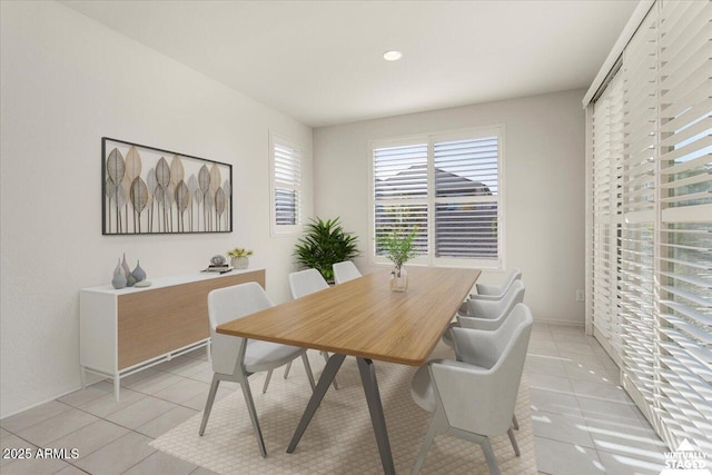 dining area featuring light tile patterned flooring