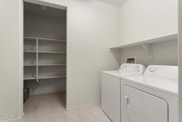 clothes washing area featuring washing machine and dryer