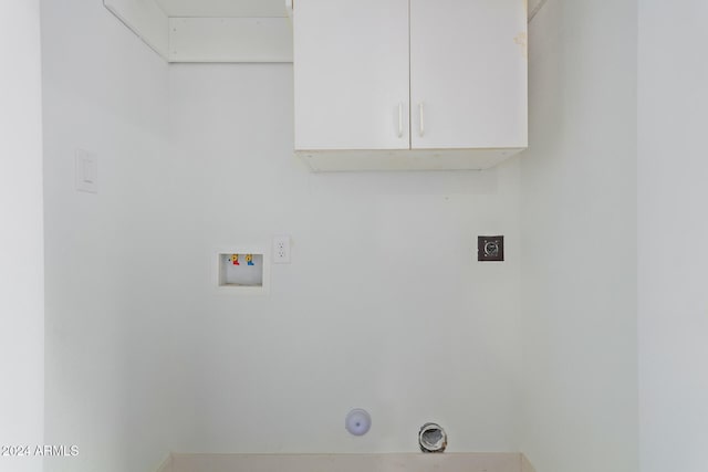 laundry room featuring hookup for a washing machine, cabinets, and electric dryer hookup