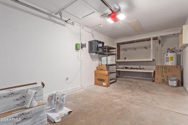 garage featuring a garage door opener and electric water heater