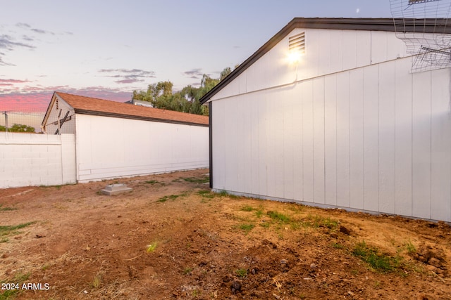 view of property exterior at dusk