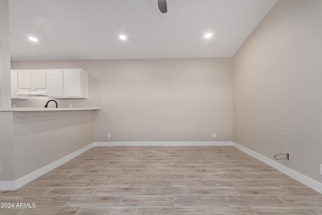 laundry area with light wood-type flooring