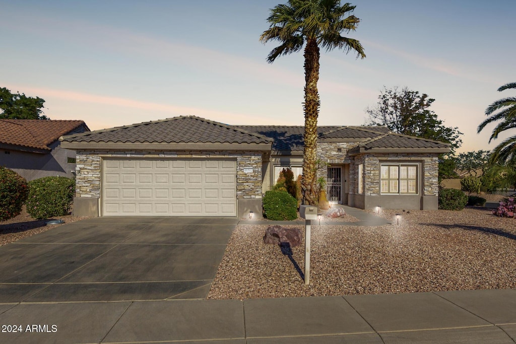 view of front of property with a garage