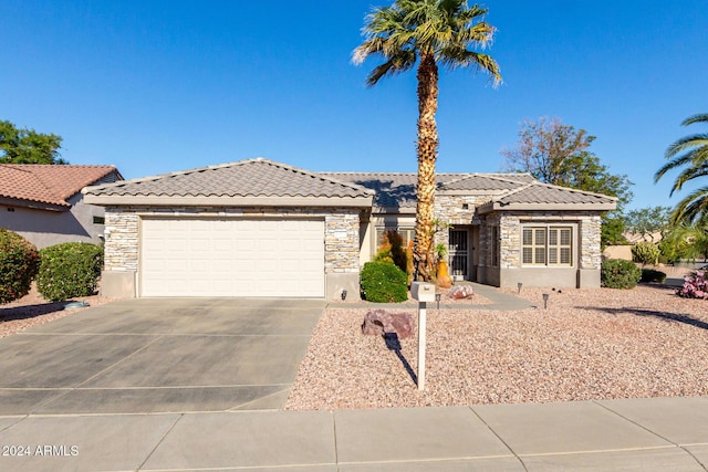 view of front of home with a garage