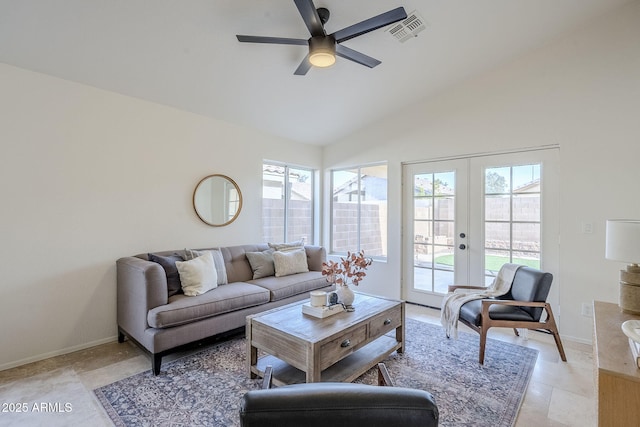 living room featuring vaulted ceiling, ceiling fan, and french doors