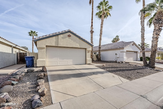 view of front of home with a garage and an outdoor structure