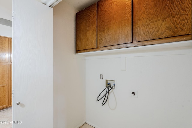 laundry room featuring washer hookup, cabinets, and hookup for an electric dryer