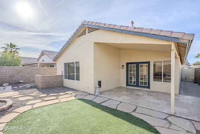 rear view of property with a patio area