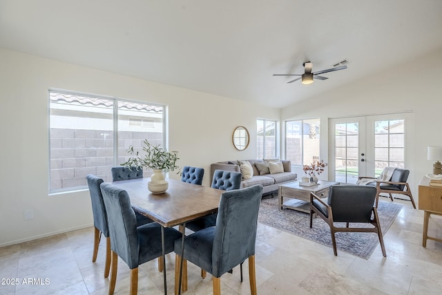 dining area featuring plenty of natural light, ceiling fan, vaulted ceiling, and french doors