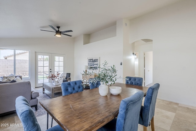 dining area with french doors, vaulted ceiling, and ceiling fan