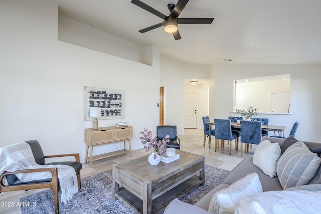 living room with vaulted ceiling and ceiling fan