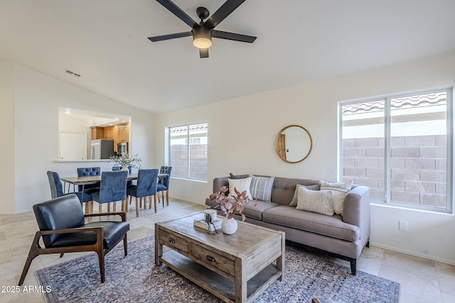 living room with vaulted ceiling and ceiling fan