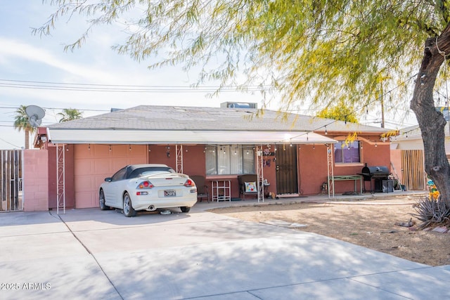 ranch-style home featuring a garage