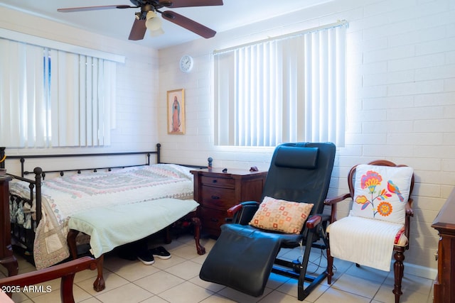 tiled bedroom featuring ceiling fan