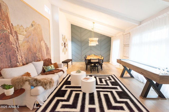 rec room featuring light hardwood / wood-style flooring and lofted ceiling with beams