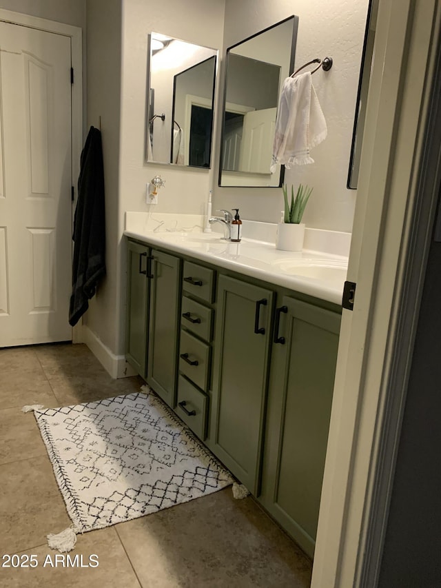 full bathroom featuring double vanity, a sink, and tile patterned floors