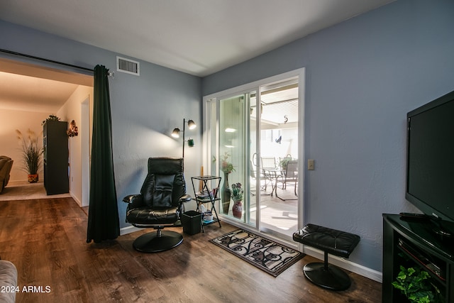 living area with wood-type flooring