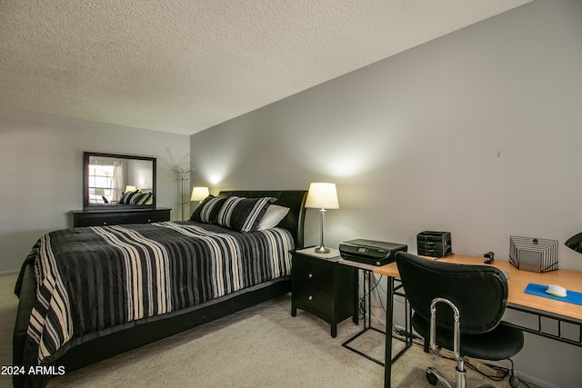 carpeted bedroom with a textured ceiling