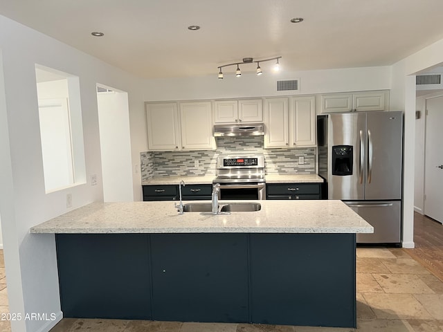 2838 E Contessa St, Mesa, AZ 85213 - kitchen with appliances with stainless steel finishes, a sink, under cabinet range hood, a peninsula, and light stone countertops
