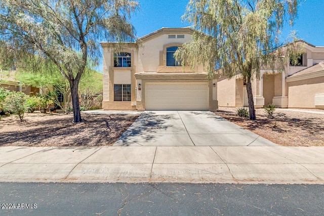 view of front of property featuring a garage