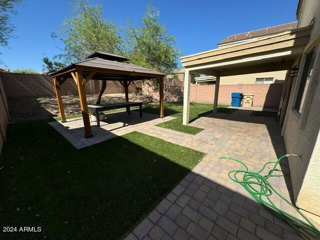 view of yard featuring a gazebo and a patio area