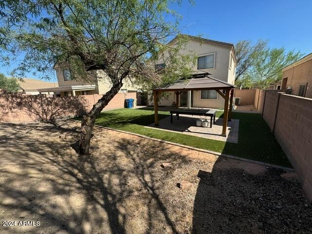 exterior space with a gazebo and a patio area