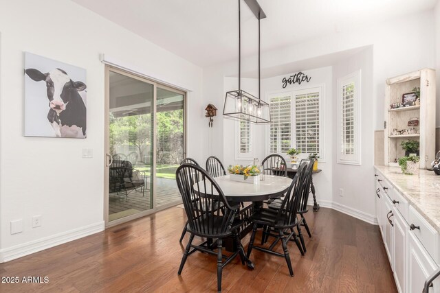 2879 E Austin Dr, Gilbert, AZ 85296 - dining room featuring dark wood-style flooring, a chandelier, and baseboards