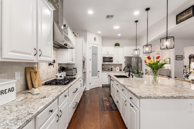 2879 E Austin Dr, Gilbert, AZ 85296 - kitchen with appliances with stainless steel finishes, a sink, dark wood-style floors, white cabinetry, and decorative backsplash