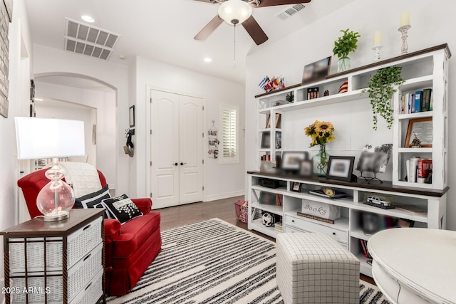 2879 E Austin Dr, Gilbert, AZ 85296 - living area with arched walkways, ceiling fan, baseboards, and recessed lighting