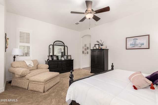 2879 E Austin Dr, Gilbert, AZ 85296 - bedroom with carpet flooring, arched walkways, baseboards, and ceiling fan