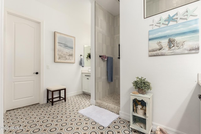 2879 E Austin Dr, Gilbert, AZ 85296 - bathroom featuring a stall shower, baseboards, and vanity