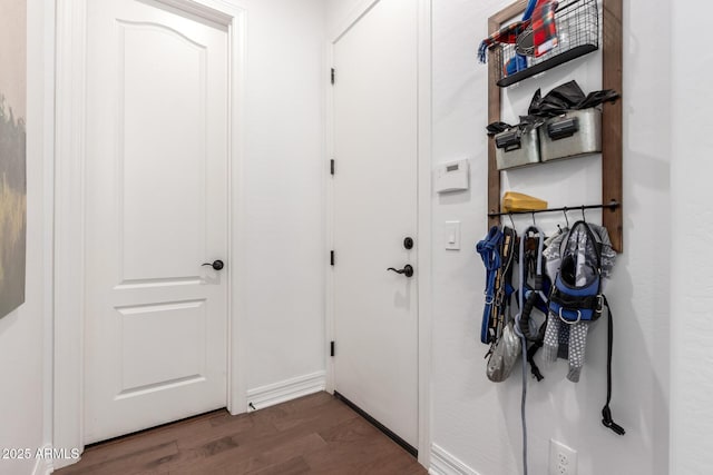 2879 E Austin Dr, Gilbert, AZ 85296 - doorway to outside with dark wood-style flooring and baseboards